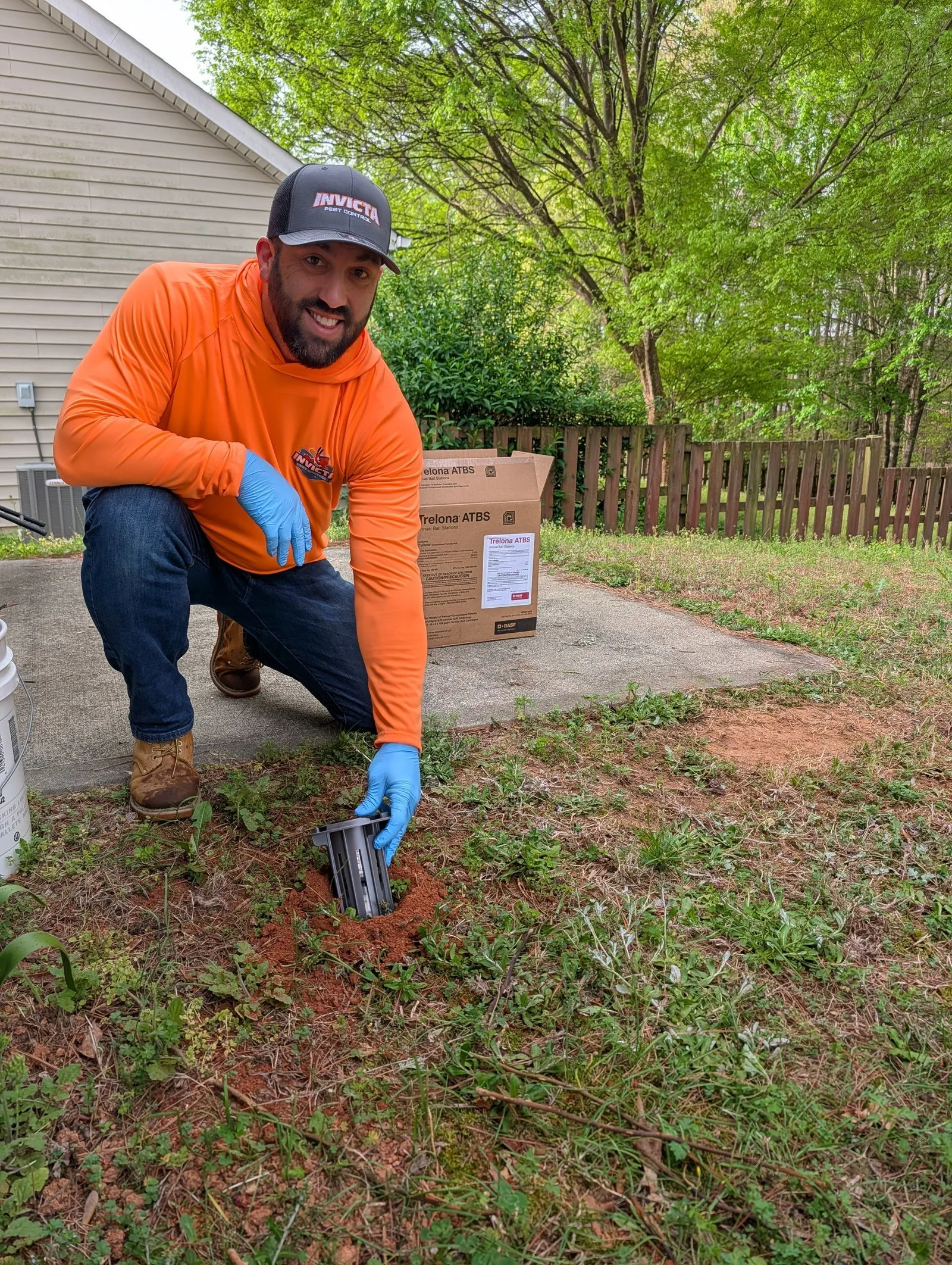 Invicta Pest Control technician at work in a customer’s yard