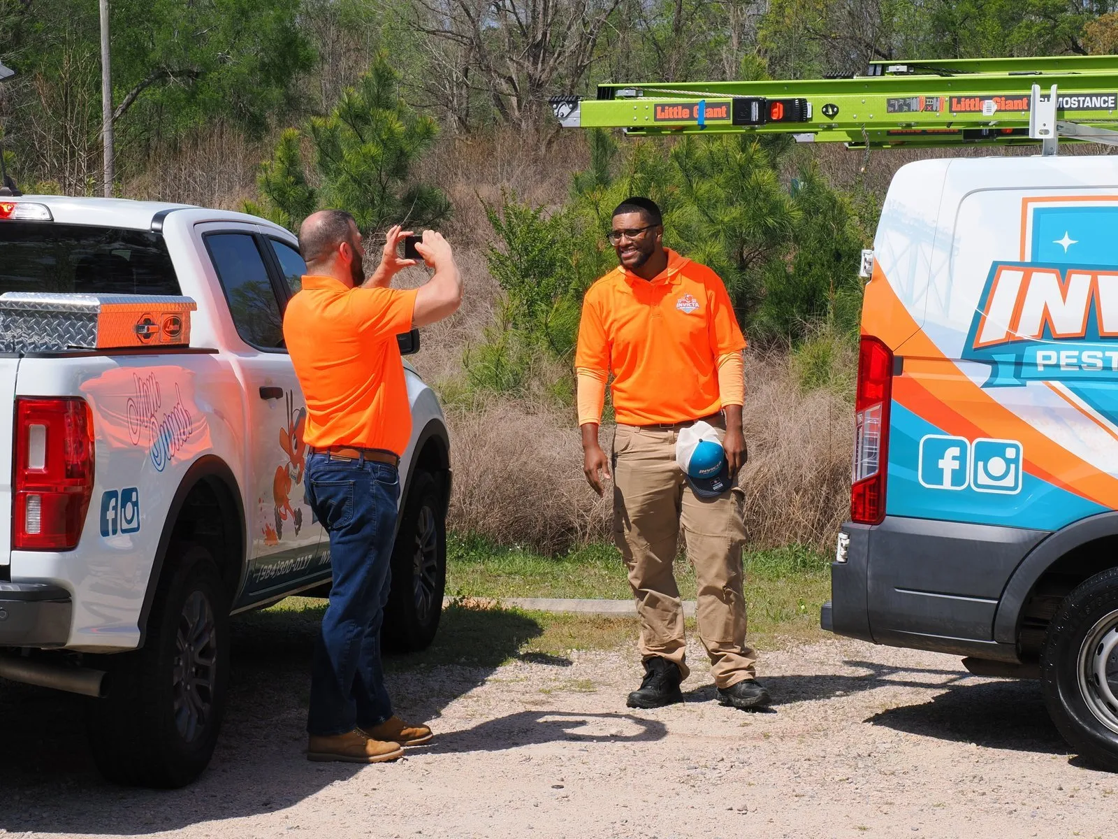 Invicta Pest Control technicians at their trucks