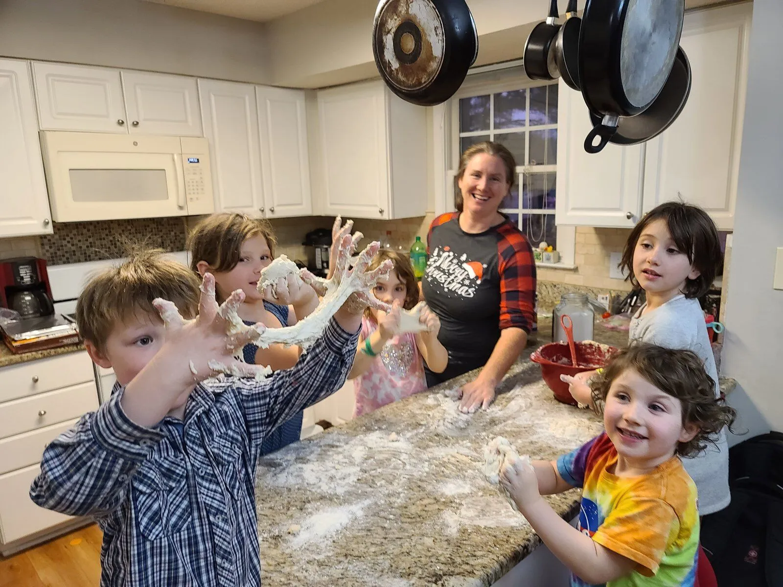 Elizabeth baking cookies with her kids